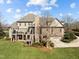 Beautiful backyard brick home features a screened in porch, patio, deck, and attached garage at 1017 Payton Ct, Raleigh, NC 27614