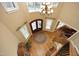 An overhead view of a large foyer with a staircase, chandelier, and decorative rug at 1017 Payton Ct, Raleigh, NC 27614