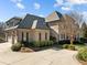 Attached two car garage with brick veneer, and an attached living space above at 1017 Payton Ct, Raleigh, NC 27614