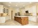 Spacious kitchen features an island, stainless steel appliances, tile flooring and white cabinets at 1017 Payton Ct, Raleigh, NC 27614