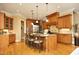 Gourmet kitchen featuring custom cabinets, stainless steel appliances, and a large center island at 1017 Payton Ct, Raleigh, NC 27614