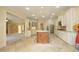 Spacious kitchen features an island, stainless steel appliances, tile flooring and wine rack at 1017 Payton Ct, Raleigh, NC 27614