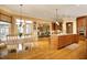 Open concept kitchen and dining area with hardwood floors and abundant natural light at 1017 Payton Ct, Raleigh, NC 27614