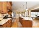 Well-appointed kitchen boasting granite countertops, custom cabinetry, and stainless steel appliances at 1017 Payton Ct, Raleigh, NC 27614