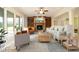 Staged living room with stone fireplace, built-in shelving, sofas, and neutral decor at 1017 Payton Ct, Raleigh, NC 27614