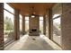 Bright sunroom with a brick fireplace, stone flooring and walls of windows at 1017 Payton Ct, Raleigh, NC 27614