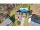 Aerial view of home showcasing a private backyard with a swimming pool and lush landscaping at 104 Spooner Ct, Holly Springs, NC 27540