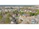A high angle view of home nestled amongst trees in neighborhood near commercial areas at 104 Spooner Ct, Holly Springs, NC 27540