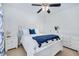 Cozy bedroom features white furniture, soft carpet, and a comfortable-looking bed at 104 Spooner Ct, Holly Springs, NC 27540