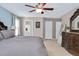 Spacious main bedroom with a view of the ensuite bathroom, dresser, and a serene atmosphere at 104 Spooner Ct, Holly Springs, NC 27540