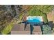 Aerial view of a private pool and patio area surrounded by mature trees at 104 Spooner Ct, Holly Springs, NC 27540