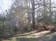Backyard featuring trees and a utility shed at 105 S Elizabeth St, Henderson, NC 27536