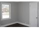 Bright bedroom featuring durable flooring, neutral walls, a new window, and a closet at 105 S Elizabeth St, Henderson, NC 27536