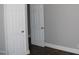 Bedroom featuring wood-look floors and an open door at 105 S Elizabeth St, Henderson, NC 27536