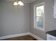 Bright dining room with neutral walls, durable flooring, and a charming light fixture at 105 S Elizabeth St, Henderson, NC 27536
