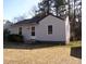 Cozy one-story home featuring vinyl siding, a new roof and trimmed front yard landscaping at 105 S Elizabeth St, Henderson, NC 27536