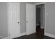 Hallway with new doors, durable flooring, and gray-painted walls at 105 S Elizabeth St, Henderson, NC 27536