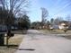 Neighborhood street with cozy homes, mailboxes, and well-kept lawns at 105 S Elizabeth St, Henderson, NC 27536