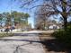 Street view of homes with a mix of charming houses and mature trees at 105 S Elizabeth St, Henderson, NC 27536