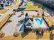 Aerial view showcases a community pool, parking, and playground at 109 Perignon Dr, Princeton, NC 27569