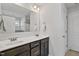 Bathroom featuring double sink vanity with dark cabinets and a large mirror above at 109 Perignon Dr, Princeton, NC 27569