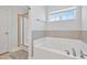 Bright bathroom features a soaking tub and glass-enclosed shower at 109 Perignon Dr, Princeton, NC 27569