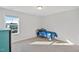 Bright bedroom with a large window and a bed with blue comforter at 109 Perignon Dr, Princeton, NC 27569
