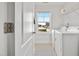 Bright laundry room featuring new washer, dryer, and large window overlooking the neighborhood at 109 Perignon Dr, Princeton, NC 27569