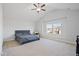 Spacious main bedroom featuring a large window, neutral carpet, a ceiling fan, and vaulted ceiling at 109 Perignon Dr, Princeton, NC 27569