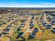 Expansive aerial view showcases a well-planned neighborhood with homes and tree-lined streets at 109 Perignon Dr, Princeton, NC 27569