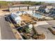 Aerial view showcasing the community's layout, pool, playground, and modern townhome exteriors at 1414 Excelsior Grand Ave, Durham, NC 27713