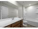 Bathroom featuring a single vanity and tub with shower at 1414 Excelsior Grand Ave, Durham, NC 27713