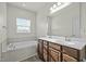 Bright bathroom features a double vanity, soaking tub, and lots of natural light at 1414 Excelsior Grand Ave, Durham, NC 27713