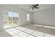 Bright bedroom with sliding glass doors leading to a balcony, filled with natural light at 1414 Excelsior Grand Ave, Durham, NC 27713