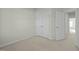 This bedroom features a carpeted floor, white walls and two closets at 1414 Excelsior Grand Ave, Durham, NC 27713