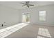 Bright bedroom with sliding glass doors leading to a balcony, filled with natural light at 1414 Excelsior Grand Ave, Durham, NC 27713