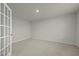 Bright, carpeted room with a closet and large window allowing for natural light at 1414 Excelsior Grand Ave, Durham, NC 27713