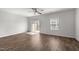 Spacious bedroom with natural light, hardwood floors, and a sliding glass door to the balcony at 1414 Excelsior Grand Ave, Durham, NC 27713