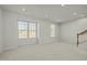 Spacious room with plush carpeting, recessed lighting, and windows offering natural light at 1414 Excelsior Grand Ave, Durham, NC 27713