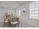 Dining room featuring two bright windows and a table set for six at 1414 Excelsior Grand Ave, Durham, NC 27713