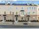 A well maintained townhome with brick facade, multiple windows, and lush front yard landscaping at 1414 Excelsior Grand Ave, Durham, NC 27713