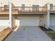Townhome featuring a private garage, offering convenient parking and additional storage at 1414 Excelsior Grand Ave, Durham, NC 27713