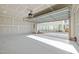 Attached two-car garage with sealed concrete floors offering direct access to the home at 1414 Excelsior Grand Ave, Durham, NC 27713