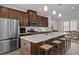 Beautiful kitchen with an island, stainless steel appliances, and bar stools, open to the dining area at 1414 Excelsior Grand Ave, Durham, NC 27713