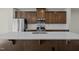 Island kitchen features stainless steel appliances, a large sink, and stylish countertops at 1414 Excelsior Grand Ave, Durham, NC 27713