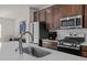 Well-equipped kitchen featuring stainless steel appliances, a large sink, and stylish countertops at 1414 Excelsior Grand Ave, Durham, NC 27713