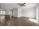 Open living area with a view into the kitchen, hardwood floors, and natural lighting at 1414 Excelsior Grand Ave, Durham, NC 27713