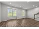 Bright living room with wood floors, recessed lighting, and large windows at 1414 Excelsior Grand Ave, Durham, NC 27713