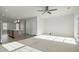 Open floor plan featuring a kitchen island, carpeted living area, and neutral color palette at 1414 Excelsior Grand Ave, Durham, NC 27713