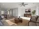 Carpeted living area featuring stylish furnishings, natural light, and an open floor plan at 1414 Excelsior Grand Ave, Durham, NC 27713